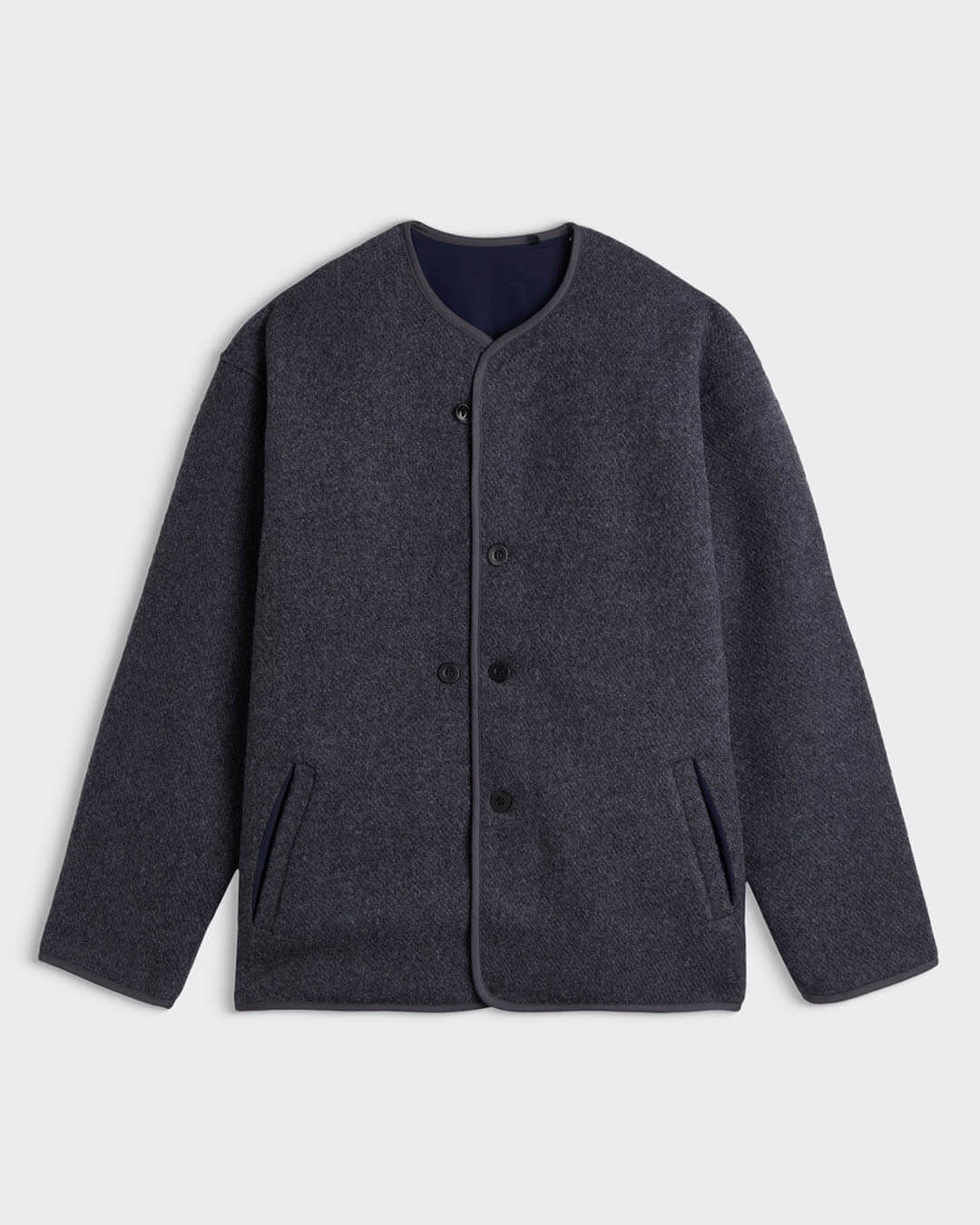 Veste Youri Woolly Anthracite Homecore, coupe large réversible, finitions en biais et œillets d’aération, style hivernal polyvalent.