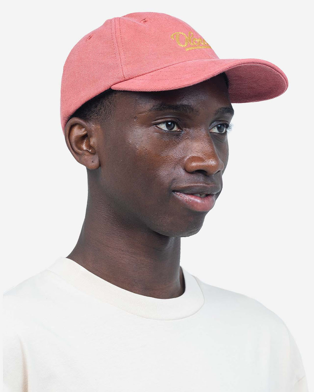 Casquette Six Panel Signature Rose Minéral OLOW en coton biologique rose, coupe six panel, visière courbée